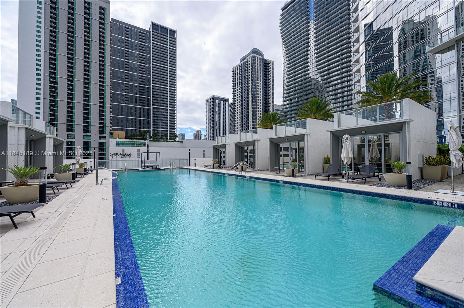851 Northeast 1st Avenue, Unit 1410 Miami, FL 33132 - Photo 34 of 43 a view of swimming pool with outdoor seating