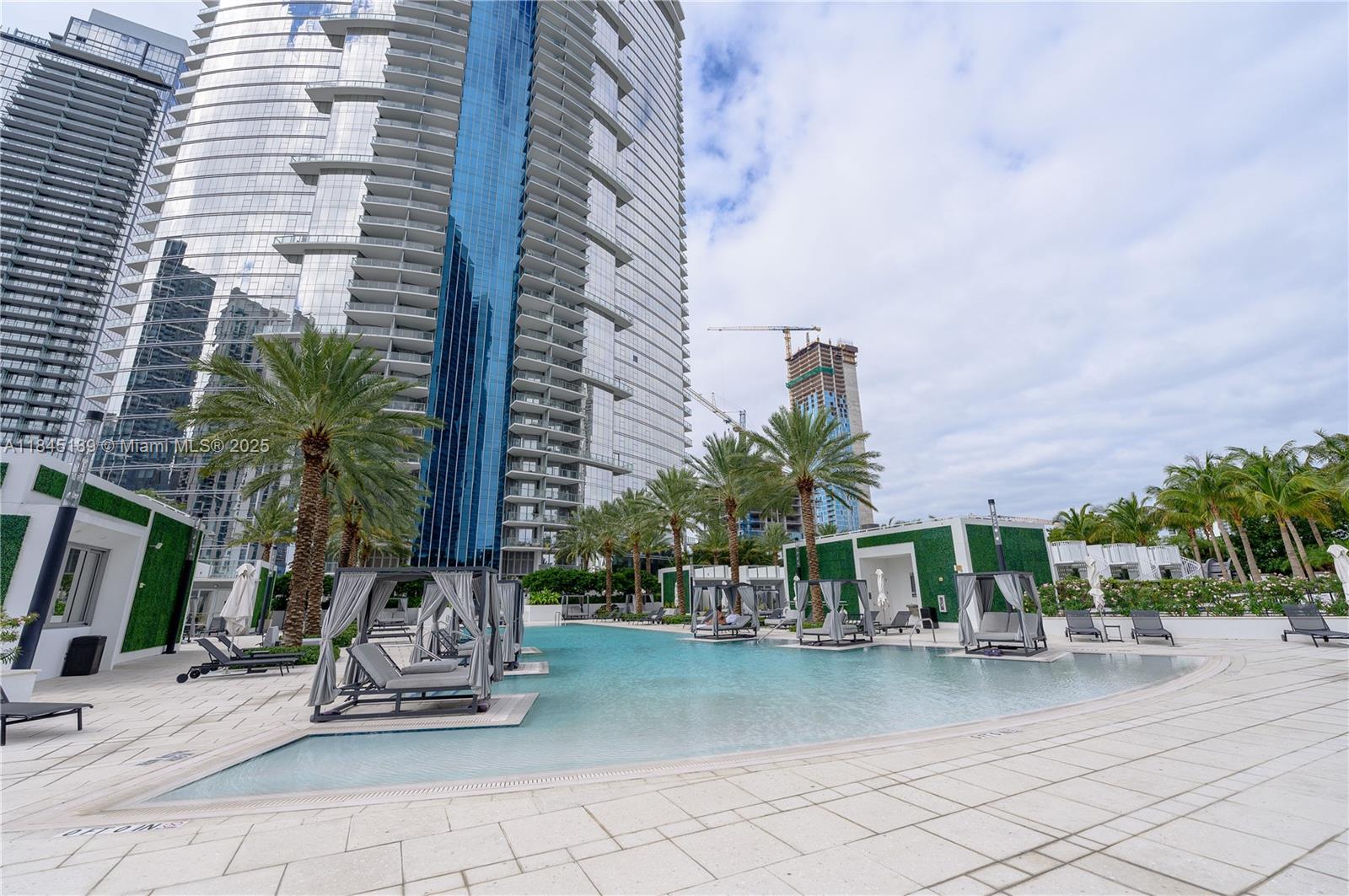 851 Northeast 1st Avenue, Unit 1410 Miami, FL 33132 - Photo 36 of 43 a front view of a building with palm trees