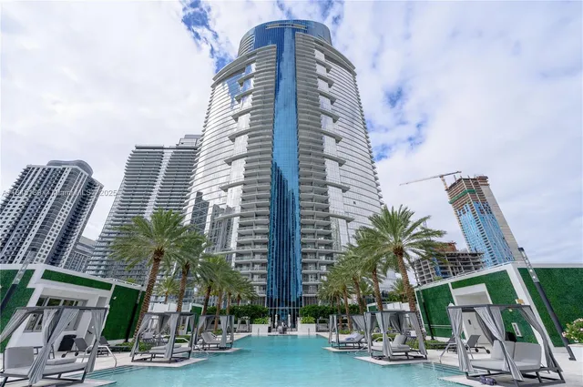 a view of a swimming pool with a yard