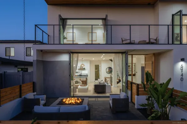 a living room with furniture and potted plant