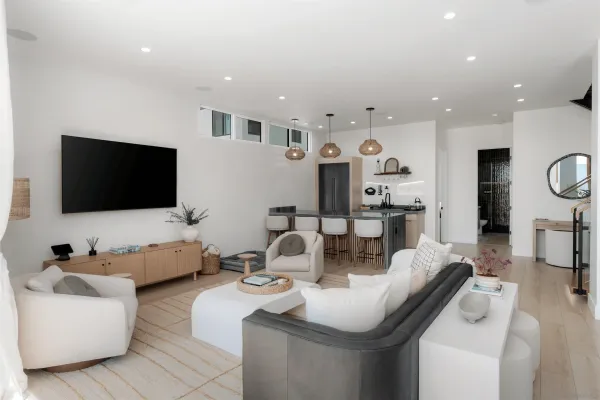 a kitchen with stainless steel appliances granite countertop a sink a stove and refrigerator