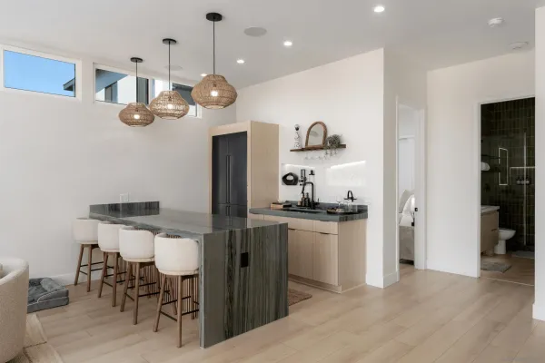 a kitchen with a table and chairs in it