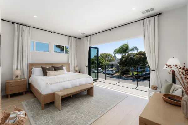 a bedroom with furniture and a flat screen tv