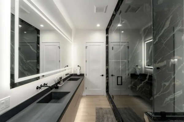 a bathroom with a sink toilet and shower