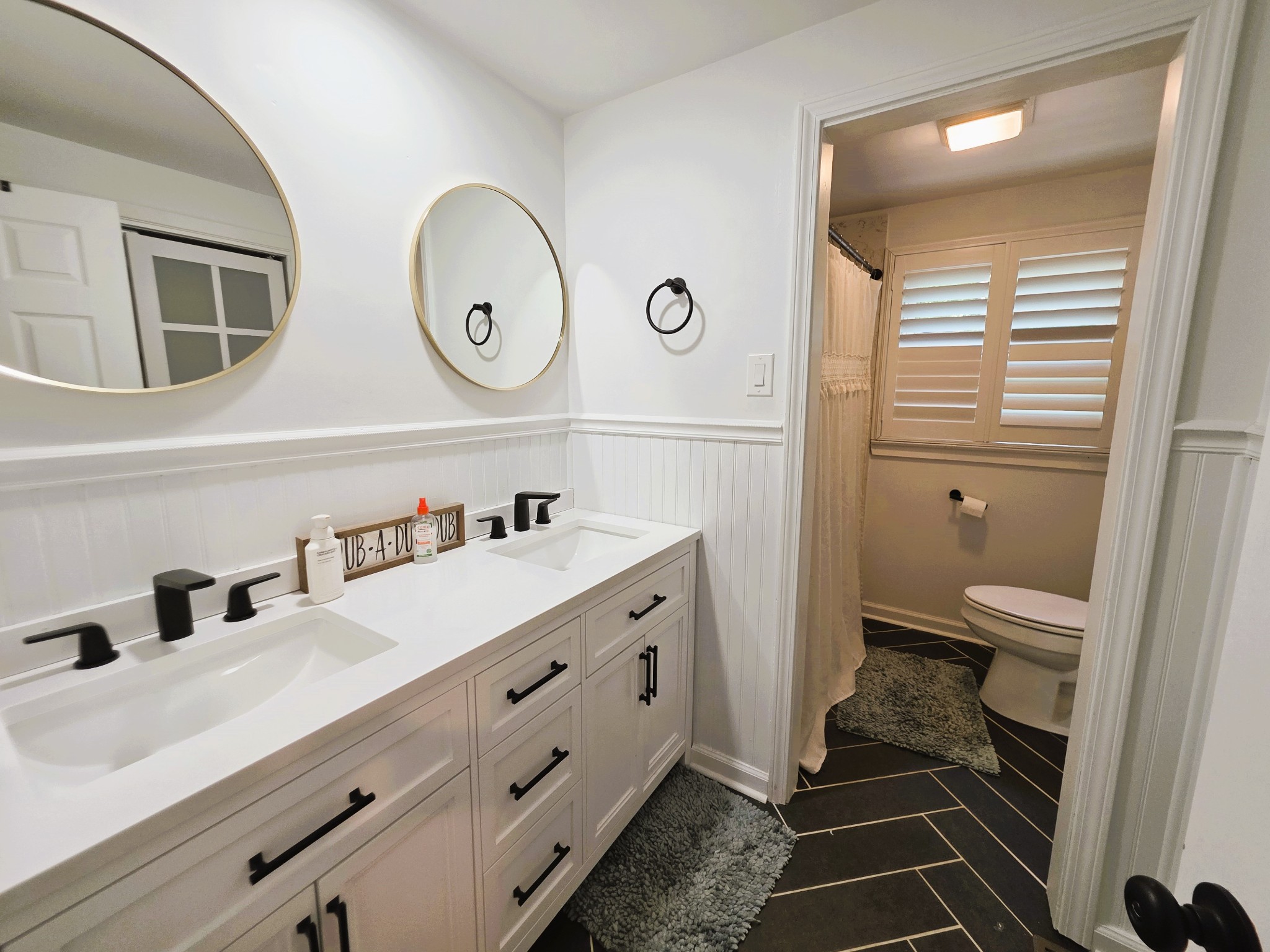 1975 Kelly Road Holladay, TN 38341 - Photo 54 of 95 a bathroom with a double vanity sink and a mirror