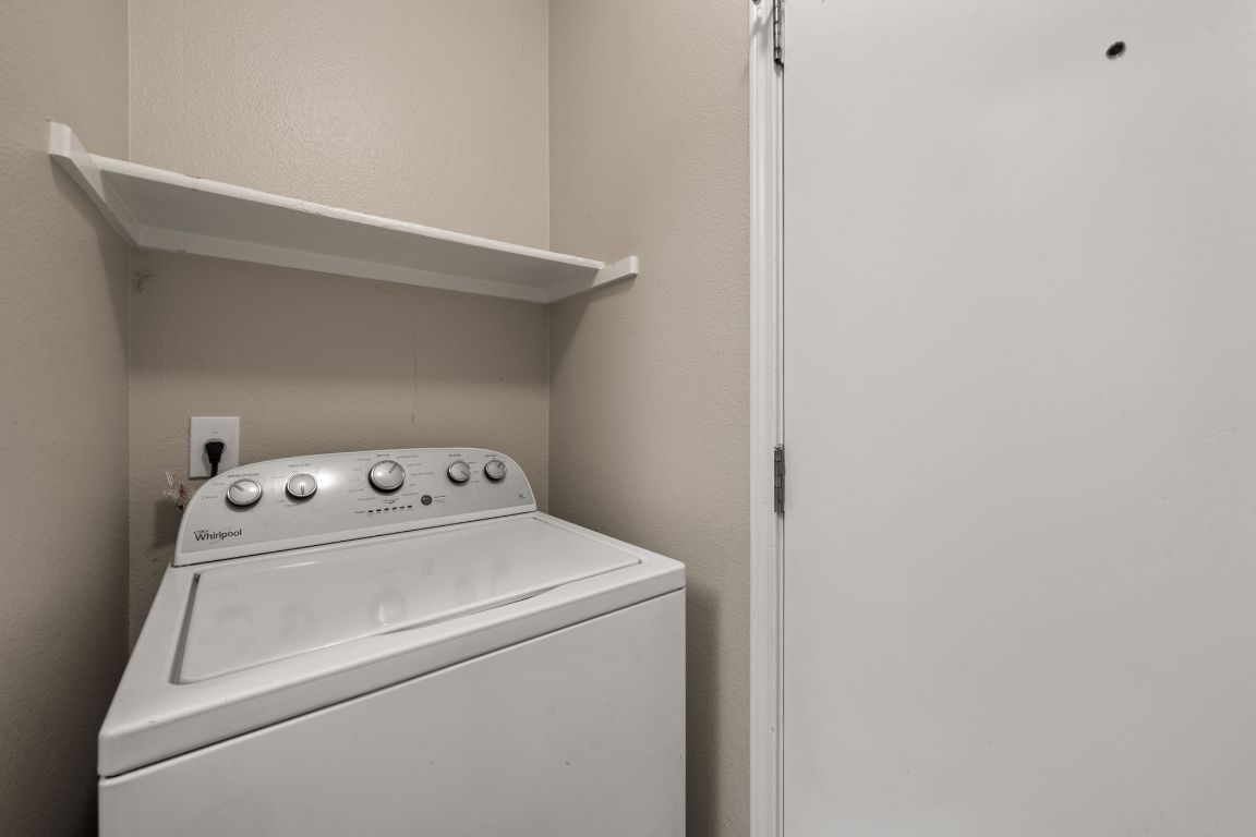 4904 Gnarled Oak Cove Austin, TX 78744 - Photo 25 of 38 a utility room with dryer and washer