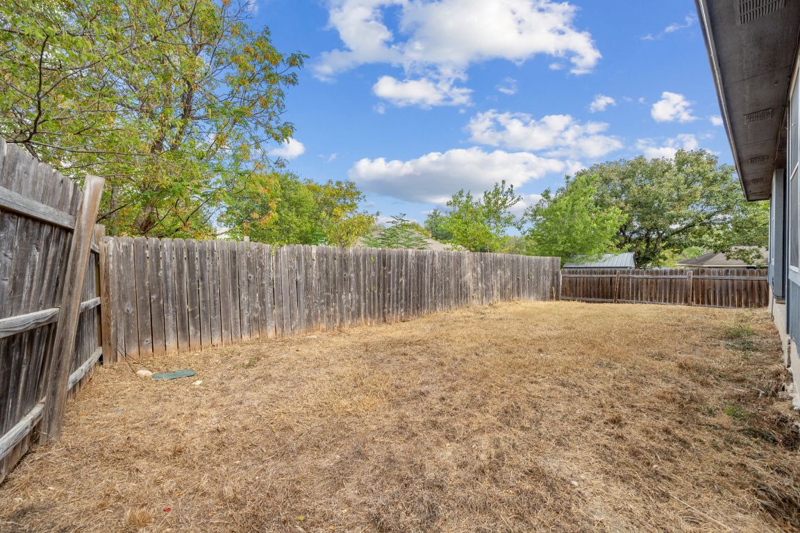 4904 Gnarled Oak Cove Austin, TX 78744 - Photo 34 of 38 a view of outdoor space with wooden fence