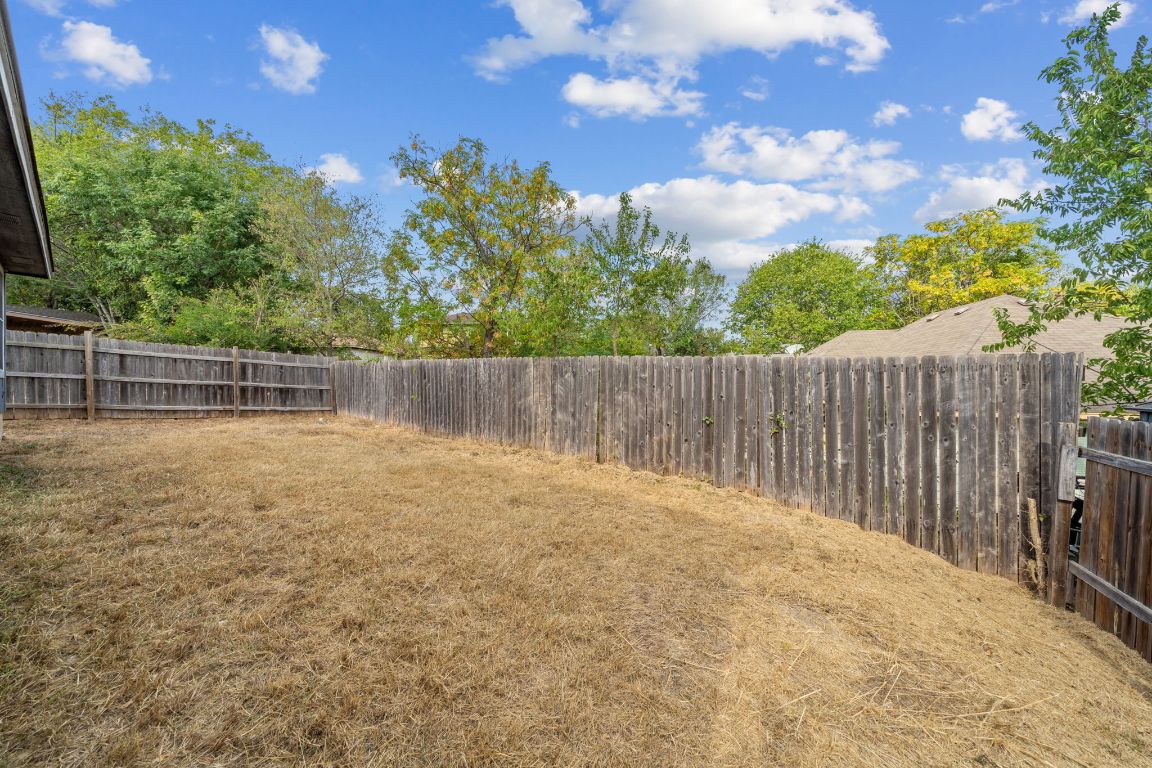 4904 Gnarled Oak Cove Austin, TX 78744 - Photo 37 of 38 a view of outdoor space with wooden fence