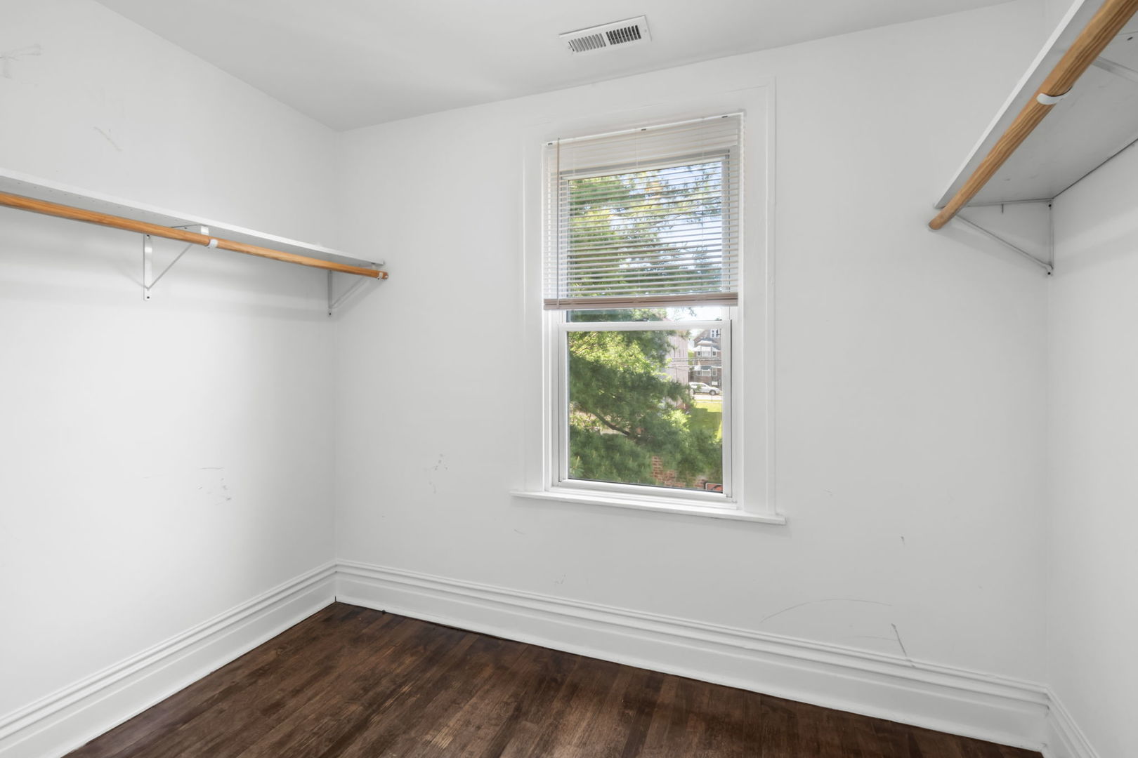 8548 South Exchange Avenue Chicago, IL 60617 - Photo 19 of 32 a view of a room with wooden floor and windows
