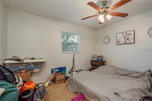 a bathroom with a sink a toilet and a shower curtain