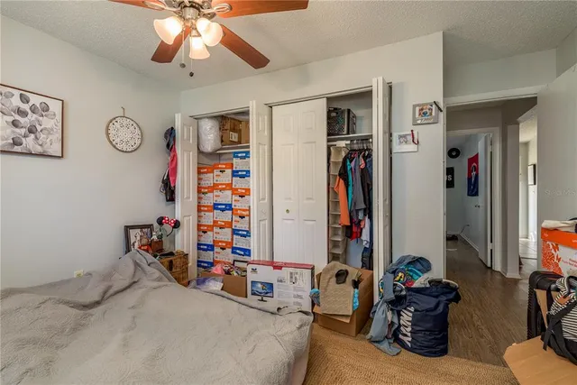 a view of a porch with furniture and wooden floor