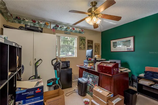 a bedroom with bed and a window