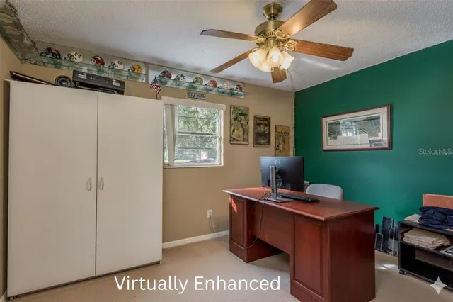 a view of a yard with wooden fence