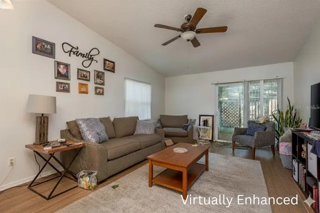 a kitchen with stainless steel appliances granite countertop a sink a stove and cabinets