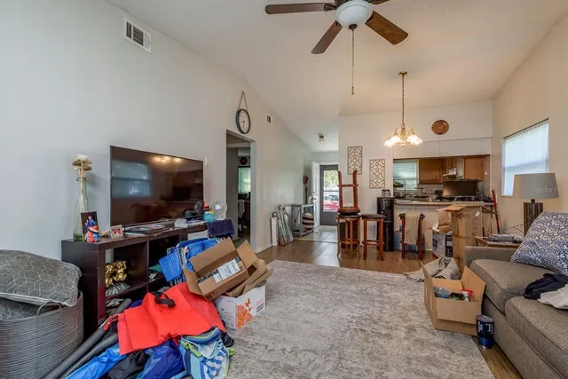a kitchen with stainless steel appliances granite countertop a refrigerator sink and stove