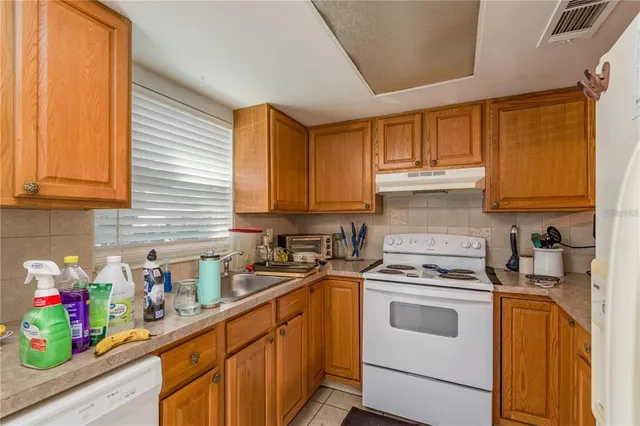 a bed room with a bed and a chair