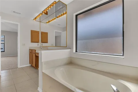 an aerial view of a house with a swimming pool