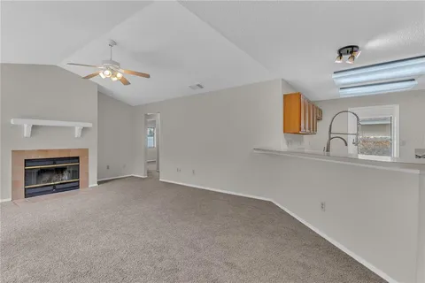 a kitchen with stainless steel appliances granite countertop a sink stove microwave and cabinets