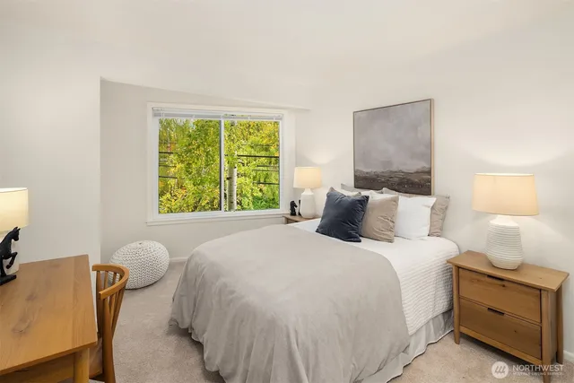 a bedroom with a bed and a window