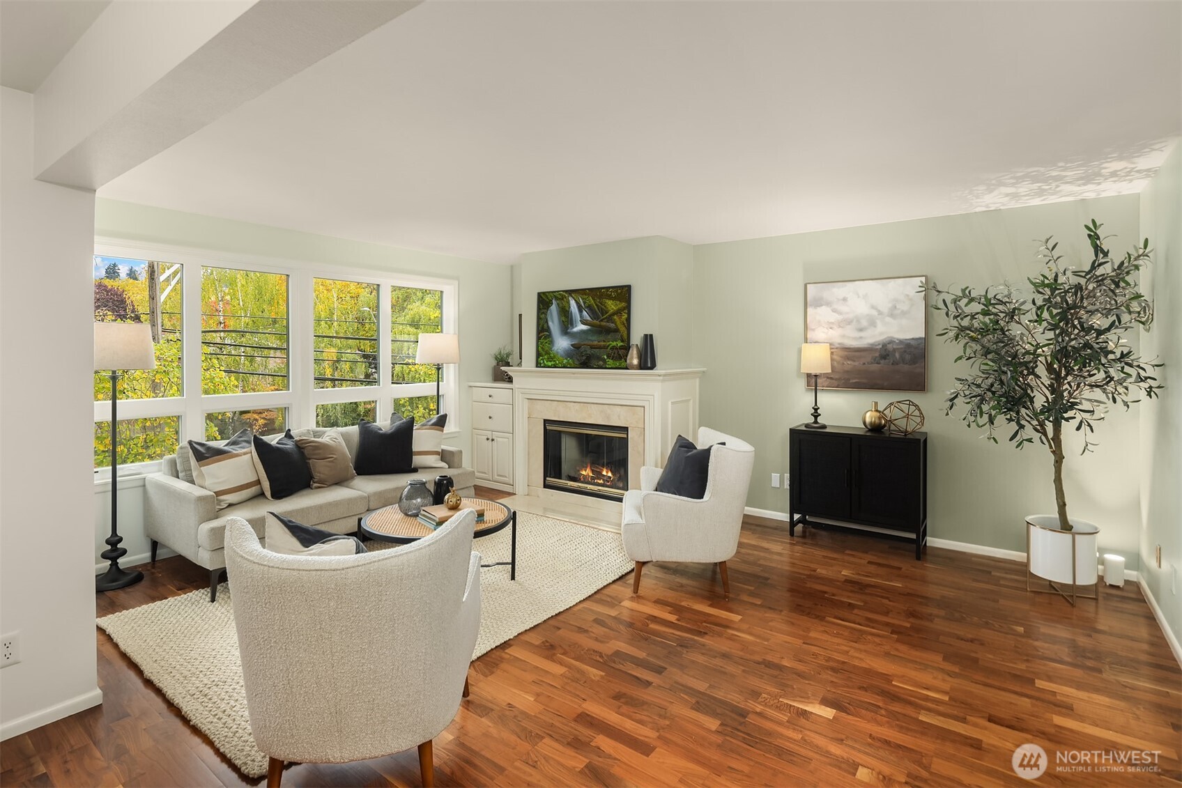 6300 Sand Point Way Northeast, Unit 212 Seattle, WA 98115 - Photo 2 of 21 a living room with furniture large window and a fireplace