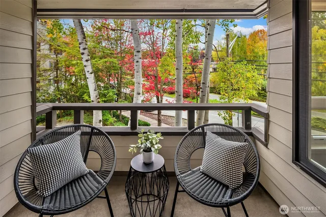 a view of a chairs and table in patio
