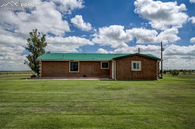 38620 Trogilo Road Rush, CO 80833 - Photo 3 of 33 ESTABLISHED GREEN GRASS AND SPRINKLER SYSTEM