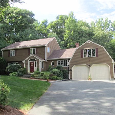 4 Raven Road Canton, MA 02021 - Photo 1 of 26 a front view of a house with a garden