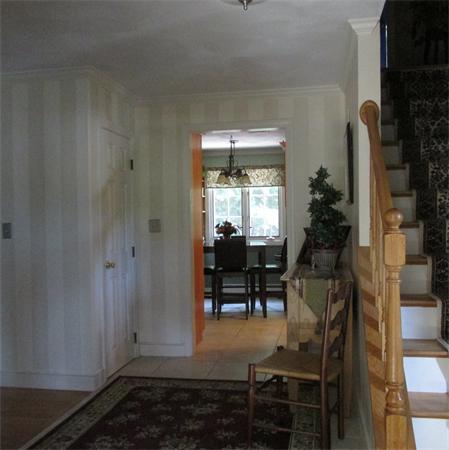 4 Raven Road Canton, MA 02021 - Photo 5 of 26 a room with lots of wooden furniture and a potted plant
