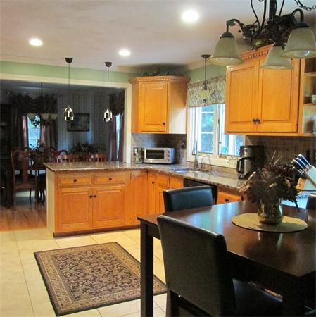 4 Raven Road Canton, MA 02021 - Photo 6 of 26 a kitchen with a sink appliances and cabinets