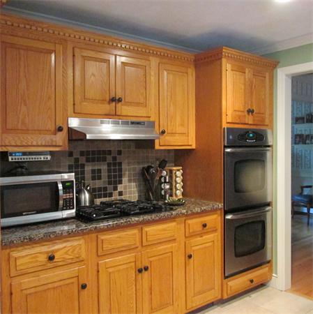 4 Raven Road Canton, MA 02021 - Photo 8 of 26 a kitchen with granite countertop cabinets stainless steel appliances and a counter space
