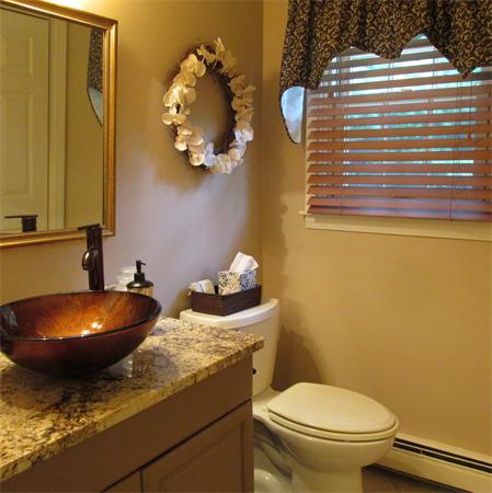 4 Raven Road Canton, MA 02021 - Photo 9 of 26 a bathroom with a granite countertop toilet and sink