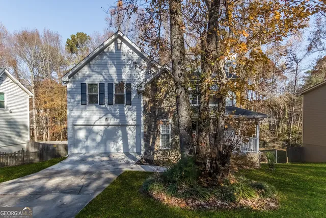 a front view of a house with a yard