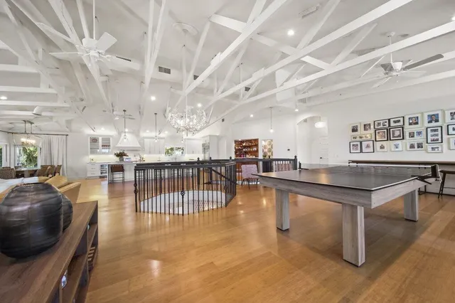 a view of a house with pool and sitting area