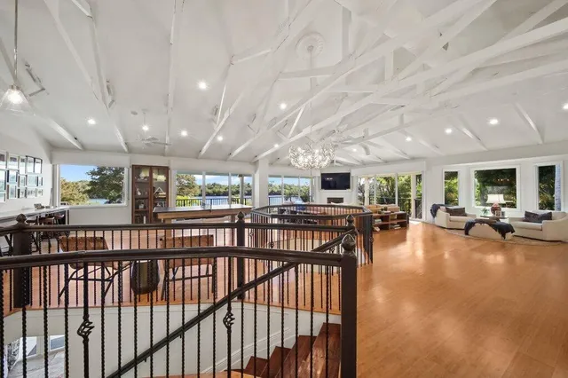 a view of a patio with couches chairs and a big yard