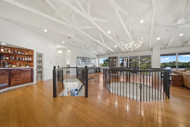 an aerial view of a house with a yard and garden