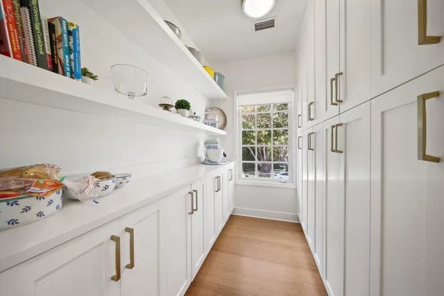 a view of a lake with a house in the background