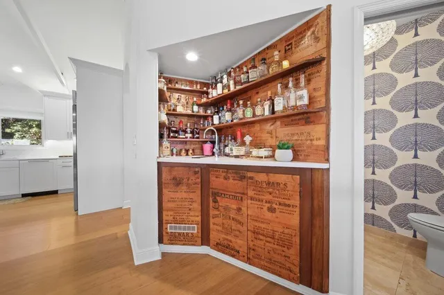 a view of balcony with furniture and wooden floor