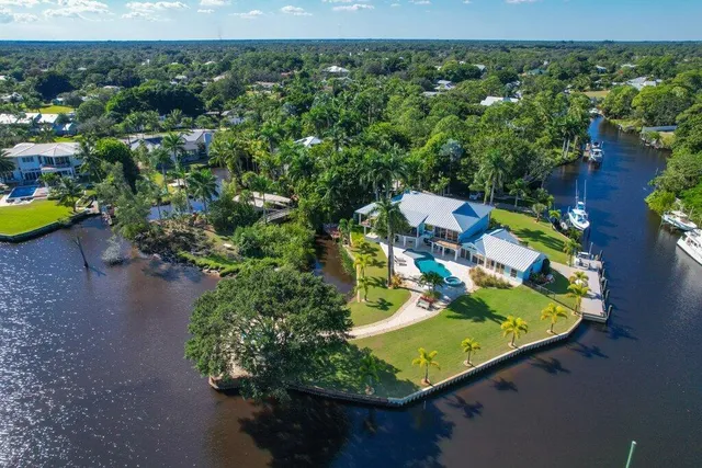 a house view with a seating space and garden