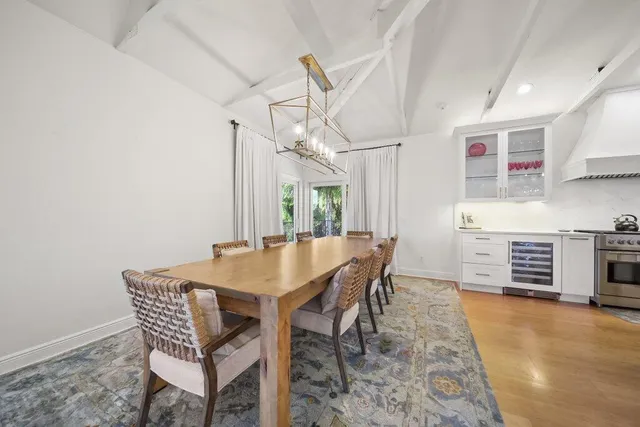 a bathroom with a granite countertop sink a toilet a mirror and shower