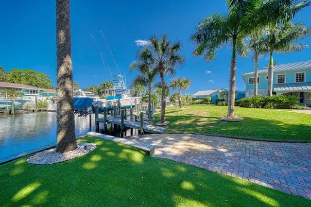a large bedroom with a bed and a flat screen tv