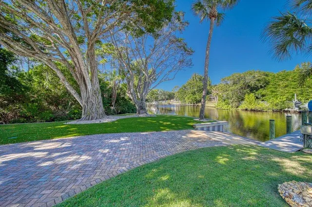 an aerial view of a house with a yard and garden