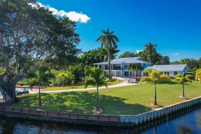 a view of an ocean house a swimming pool and outdoor space