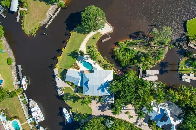 a view of a swimming pool with a patio and a yard