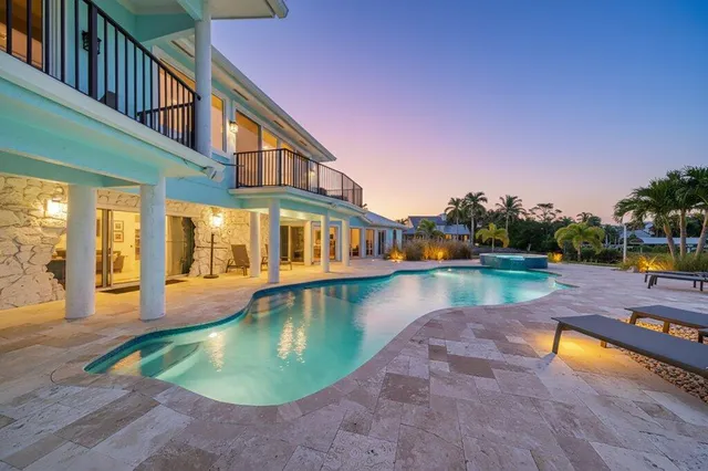 a view of a swimming pool with a lounge chairs