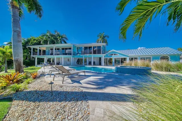 a view of a swimming pool with a table and chairs