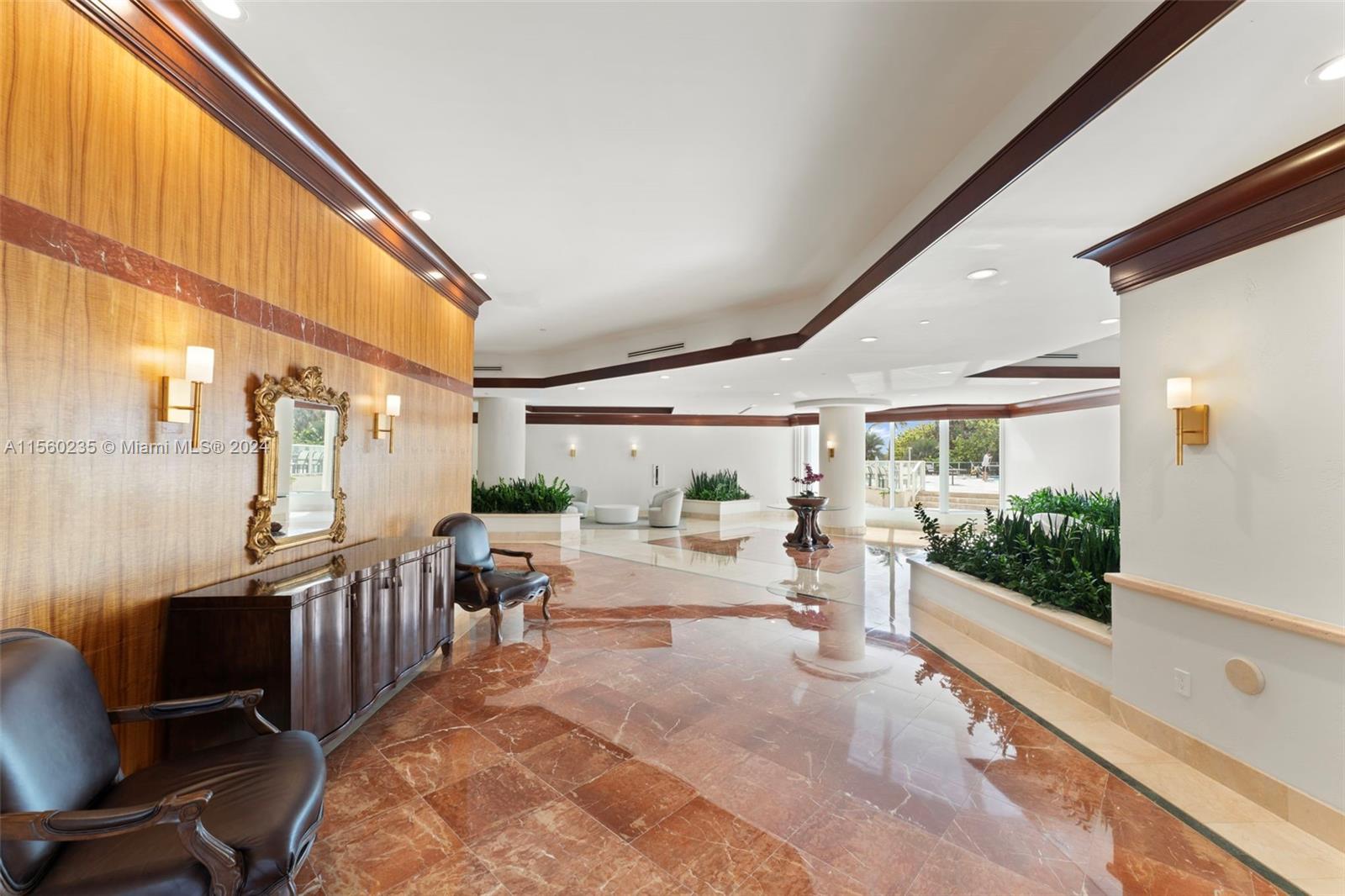 8925 Collins Avenue, Unit 2J Surfside, FL 33154 - Photo 22 of 62 a very nice looking room with many windows