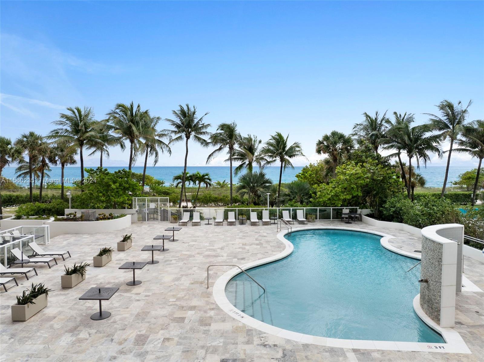 8925 Collins Avenue, Unit 2J Surfside, FL 33154 - Photo 26 of 62 a view of a swimming pool with a patio