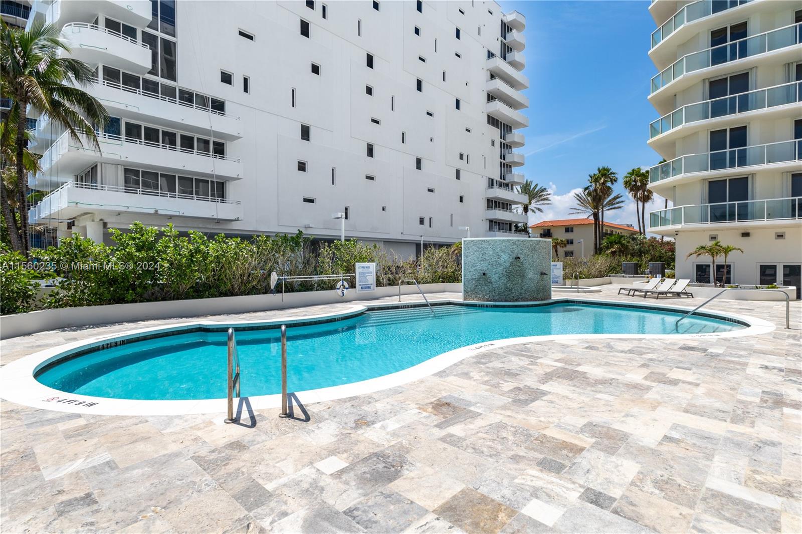 8925 Collins Avenue, Unit 2J Surfside, FL 33154 - Photo 42 of 62 a swimming pool with view of buildings
