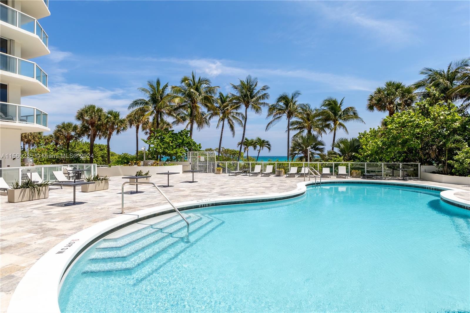 8925 Collins Avenue, Unit 2J Surfside, FL 33154 - Photo 43 of 62 a view of outdoor space with swimming pool and lounge chair