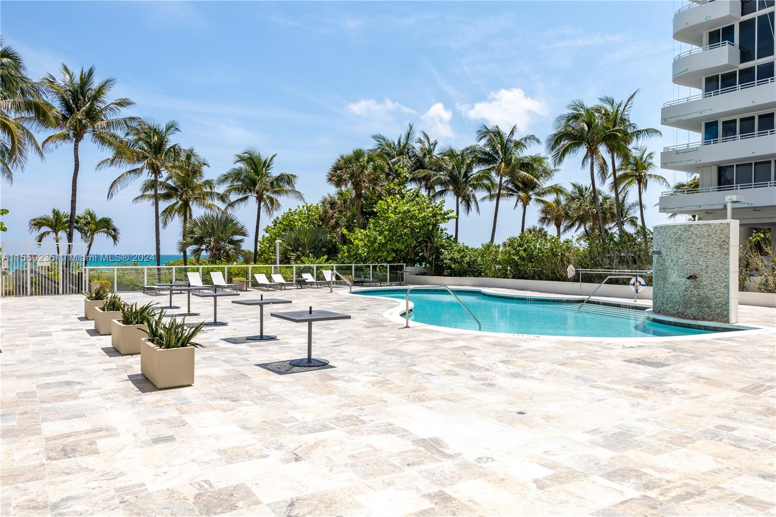 8925 Collins Avenue, Unit 2J Surfside, FL 33154 - Photo 44 of 62 a view of lake with a couch and trees